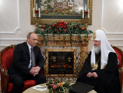 Путин подарил Патриарху на именины постановления о передаче Церкви недвижимого имущества